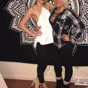 White halter top with open back on the left